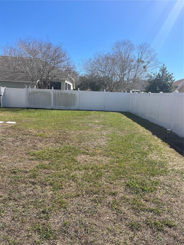 view of yard featuring a fenced backyard