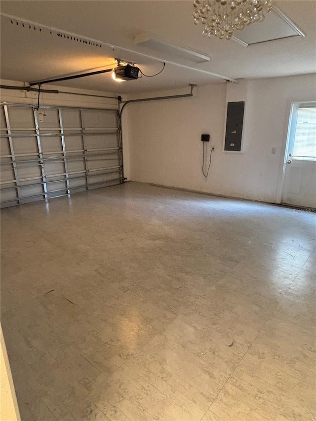 garage featuring electric panel and a garage door opener