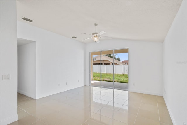 4954 SW 40th Pl, Ocala, FL 34474 - spare room with a ceiling fan, lofted ceiling, tile patterned flooring, and baseboards