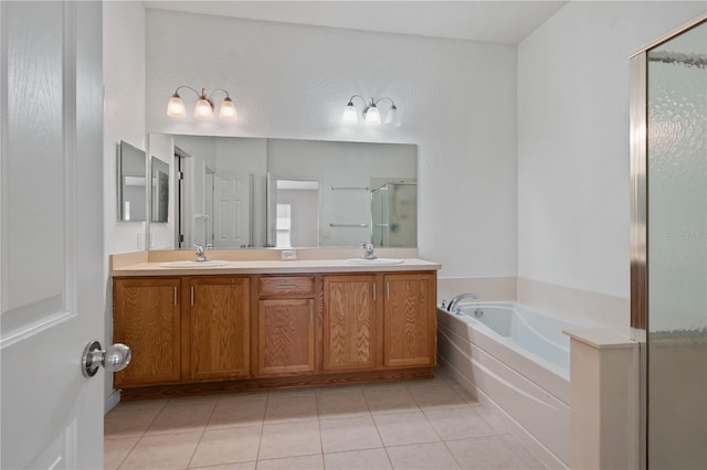 4954 SW 40th Pl, Ocala, FL 34474 - full bath with a stall shower, a garden tub, tile patterned floors, and double vanity