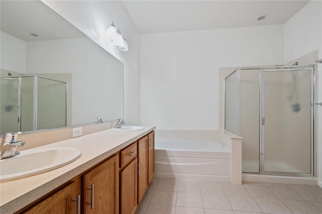 4954 SW 40th Pl, Ocala, FL 34474 - full bathroom featuring tile patterned flooring, a stall shower, a bath, and double vanity