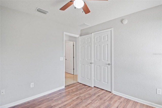 4954 SW 40th Pl, Ocala, FL 34474 - unfurnished bedroom featuring light wood-type flooring, baseboards, and ceiling fan