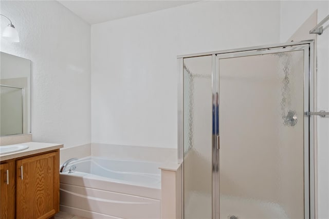4954 SW 40th Pl, Ocala, FL 34474 - bathroom with vanity, a shower stall, and a garden tub