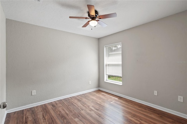 4954 SW 40th Pl, Ocala, FL 34474 - spare room with wood finished floors, a ceiling fan, and baseboards