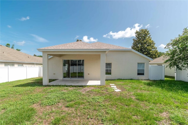 4954 SW 40th Pl, Ocala, FL 34474 - back of house featuring a patio, stucco siding, and a shingled roof