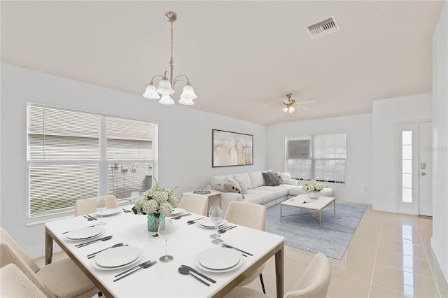 4954 SW 40th Pl, Ocala, FL 34474 - dining area featuring healthy amount of natural light, a chandelier, ceiling fan, and light tile patterned flooring