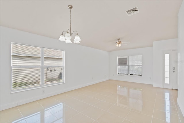 4954 SW 40th Pl, Ocala, FL 34474 - unfurnished room featuring plenty of natural light, light tile patterned flooring, a ceiling fan, and a chandelier