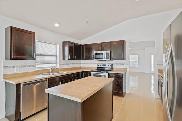 4954 SW 40th Pl, Ocala, FL 34474 - kitchen featuring stainless steel appliances, a sink, light countertops, dark brown cabinets, and vaulted ceiling
