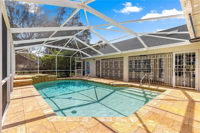 pool with a lanai and a patio