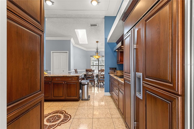 kitchen with light tile patterned floors, visible vents, light stone countertops, crown molding, and a textured ceiling