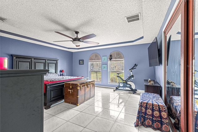 bedroom featuring light tile patterned floors, a textured ceiling, and visible vents