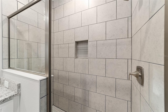 bathroom featuring a shower stall