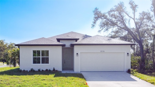 view of front facade with concrete driveway, an attached garage, roof with shingles, and stucco siding