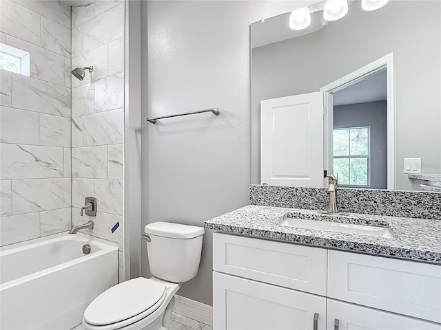 full bath with vanity, toilet, baseboards, and shower / bath combination