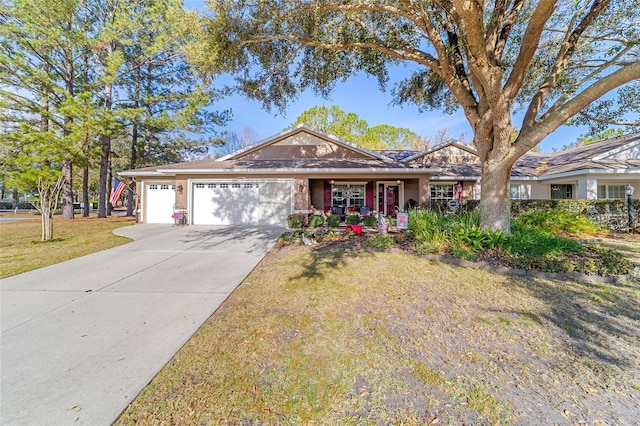 ranch-style home featuring a garage, driveway, a front lawn, and stucco siding