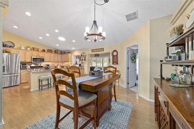 dining area featuring recessed lighting, a notable chandelier, visible vents, vaulted ceiling, and light wood-type flooring