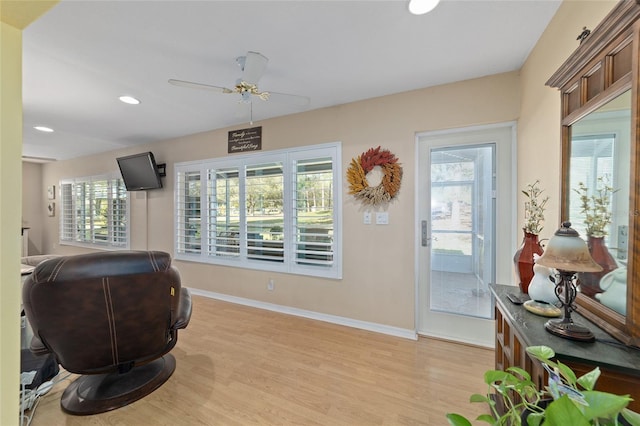 interior space featuring a ceiling fan, recessed lighting, light wood-style flooring, and baseboards