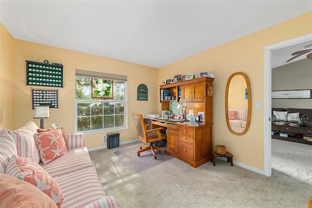 home office featuring light carpet and baseboards