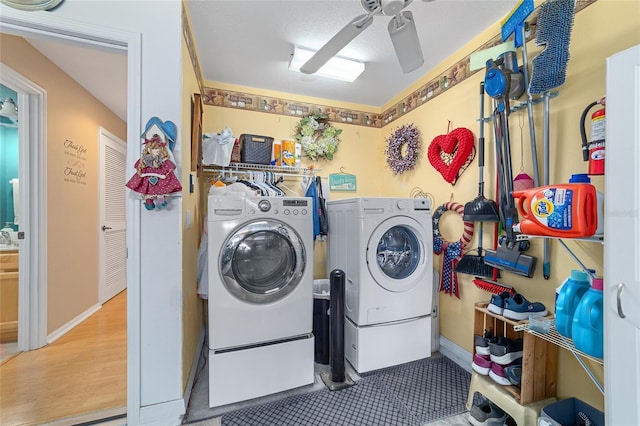 laundry area featuring laundry area, ceiling fan, and washer and clothes dryer