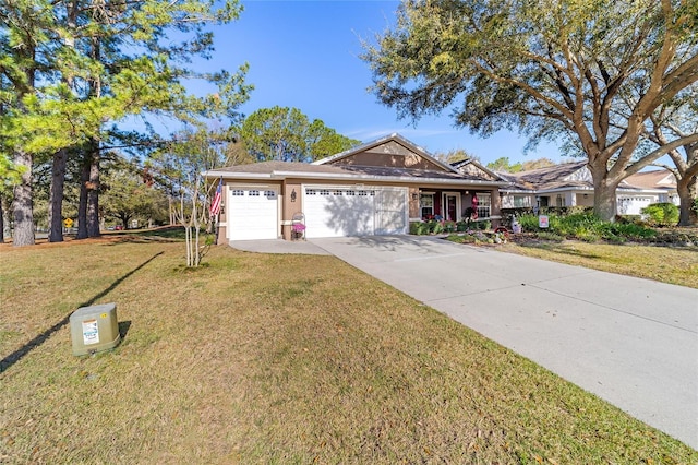 ranch-style home featuring a garage, concrete driveway, a front yard, and stucco siding