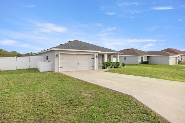 ranch-style home with concrete driveway, an attached garage, fence, a front lawn, and stucco siding