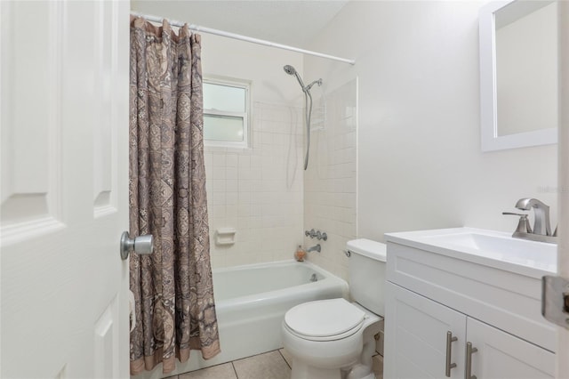 bathroom featuring shower / tub combo with curtain, vanity, toilet, and tile patterned floors