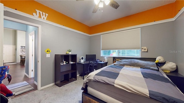 bedroom featuring carpet floors, baseboards, and a ceiling fan