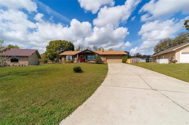 ranch-style home with an attached garage, driveway, a chimney, and a front yard