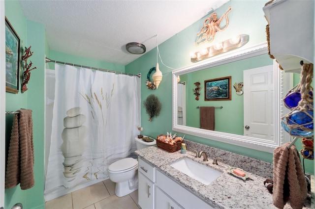 bathroom featuring a shower with curtain, toilet, vanity, a textured ceiling, and tile patterned flooring