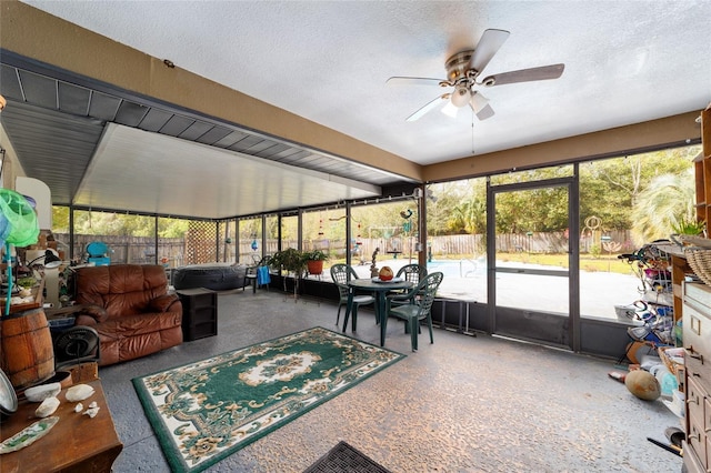 sunroom / solarium with a ceiling fan