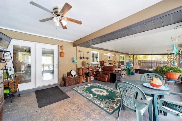 interior space with ceiling fan and beam ceiling