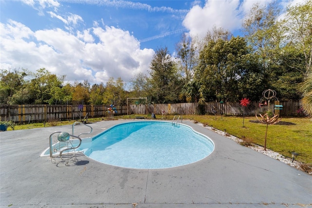 view of pool featuring a patio area, a fenced backyard, a fenced in pool, and a yard