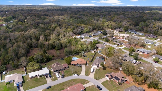 aerial view with a residential view and a wooded view