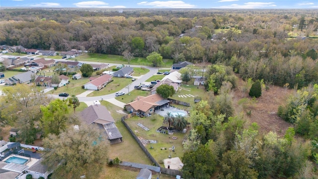 aerial view with a residential view and a view of trees