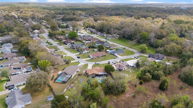 bird's eye view with a forest view and a residential view