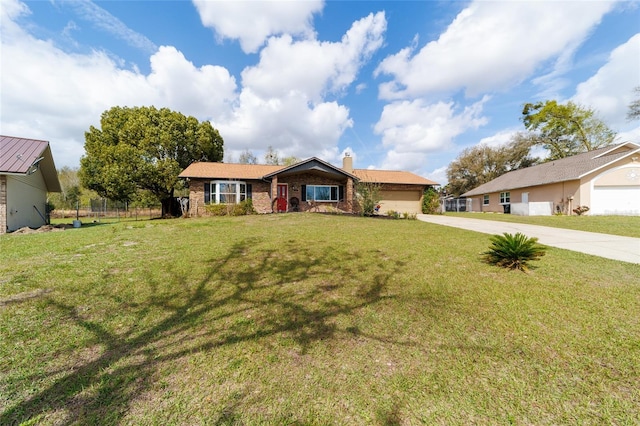 ranch-style home featuring brick siding, a chimney, concrete driveway, a front yard, and a garage