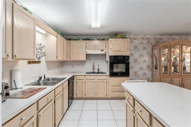 kitchen with wallpapered walls, under cabinet range hood, light countertops, a textured ceiling, and black appliances