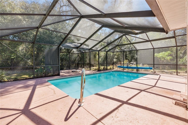 outdoor pool featuring a lanai and a patio area