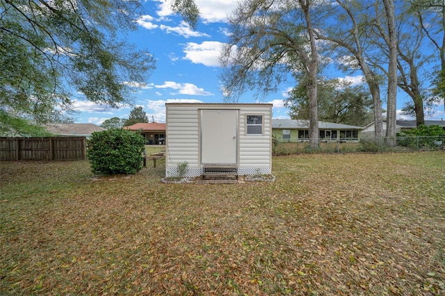 view of shed with a fenced backyard