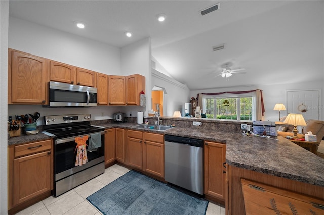 kitchen featuring stainless steel appliances, visible vents, a sink, and light tile patterned floors