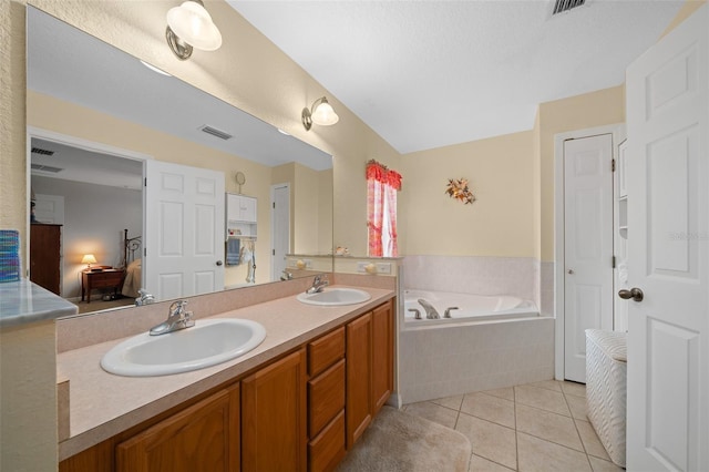 full bathroom with connected bathroom, visible vents, a sink, and tile patterned floors