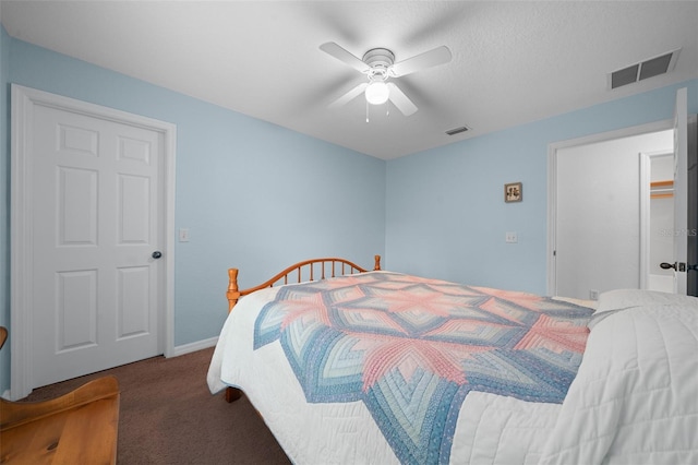 carpeted bedroom featuring visible vents, ceiling fan, and baseboards