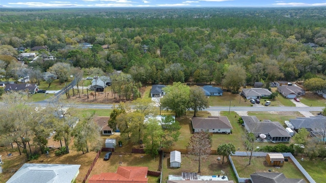 bird's eye view with a residential view and a view of trees