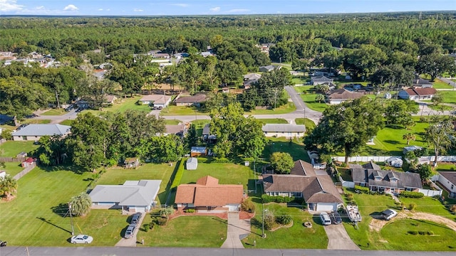 bird's eye view featuring a residential view and a view of trees