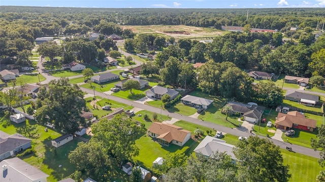 aerial view featuring a residential view and a view of trees