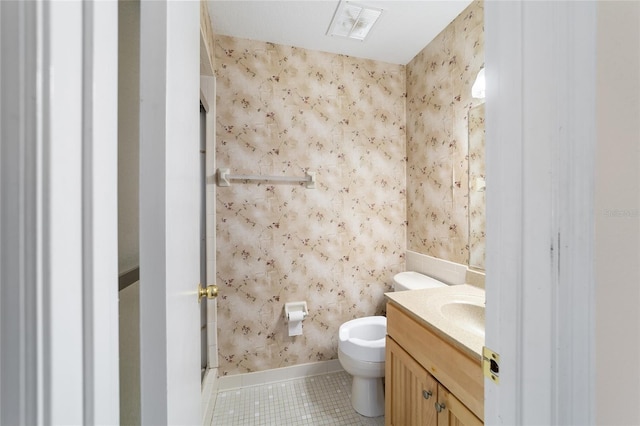 bathroom with visible vents, wallpapered walls, toilet, tile patterned floors, and vanity