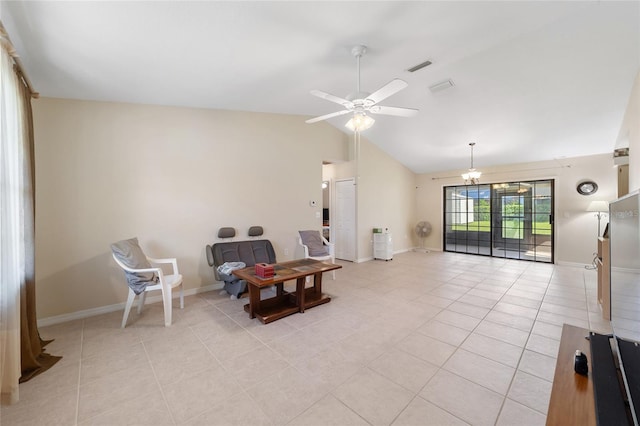 sitting room with lofted ceiling, light tile patterned floors, visible vents, and baseboards