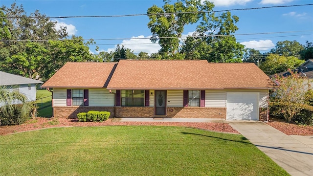 single story home with brick siding, a front lawn, roof with shingles, a garage, and driveway