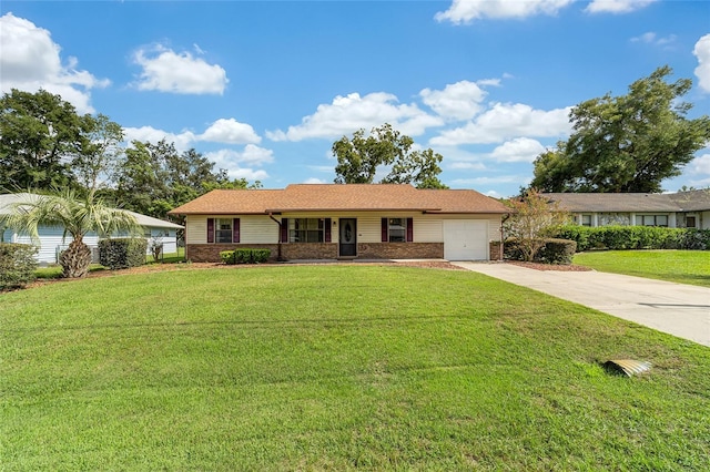 single story home with brick siding, an attached garage, concrete driveway, and a front lawn