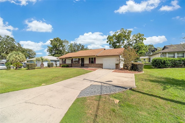 single story home with a front lawn, brick siding, a garage, and driveway